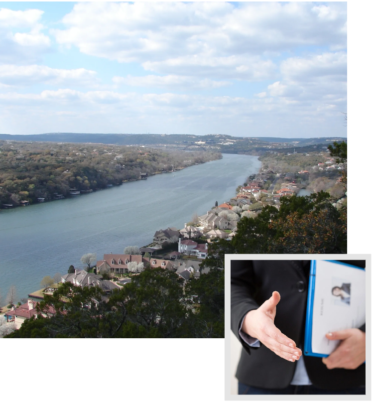 A person holding an open book and looking at the river.